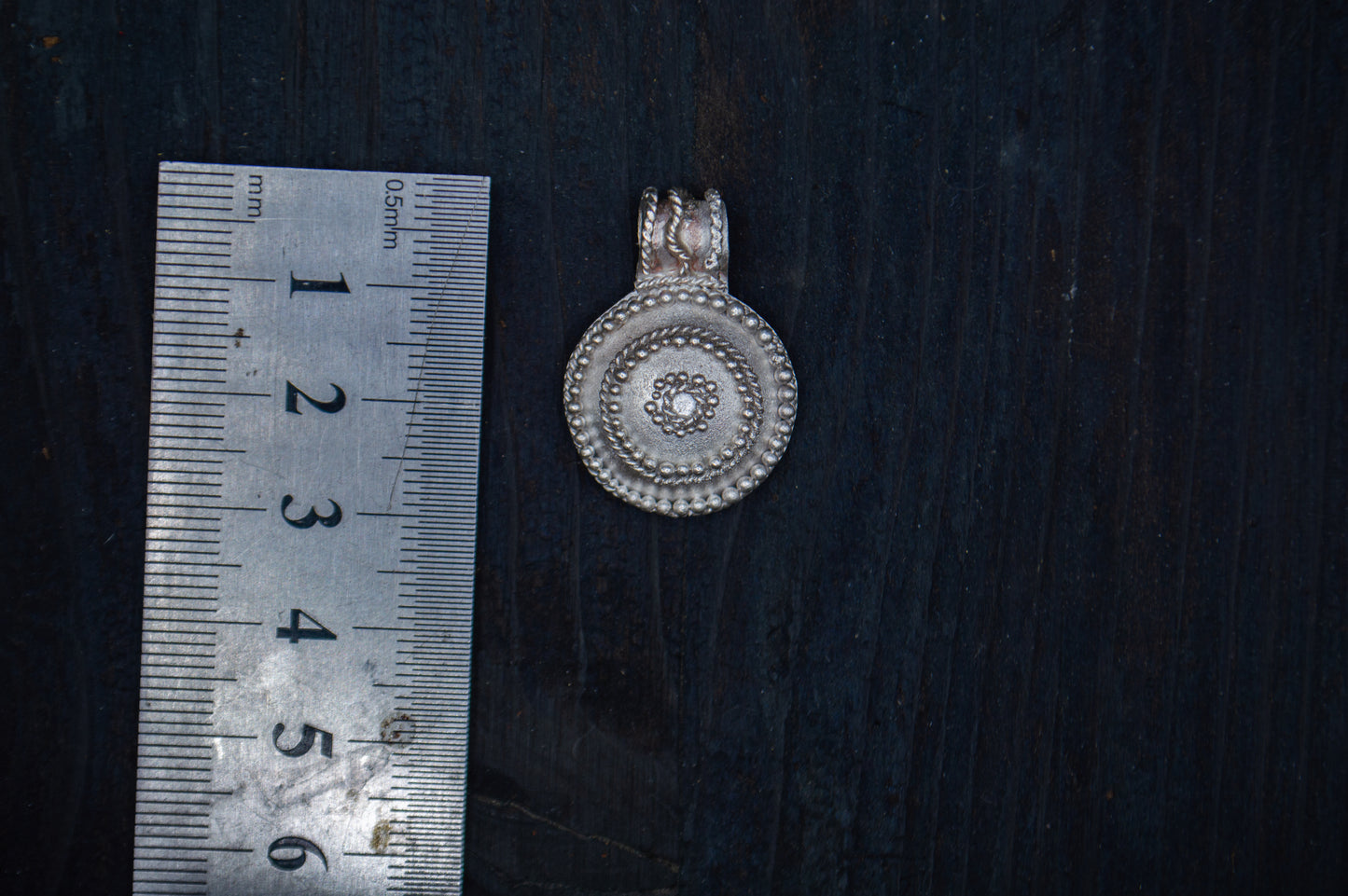 Silver pendant with filigree and granulation