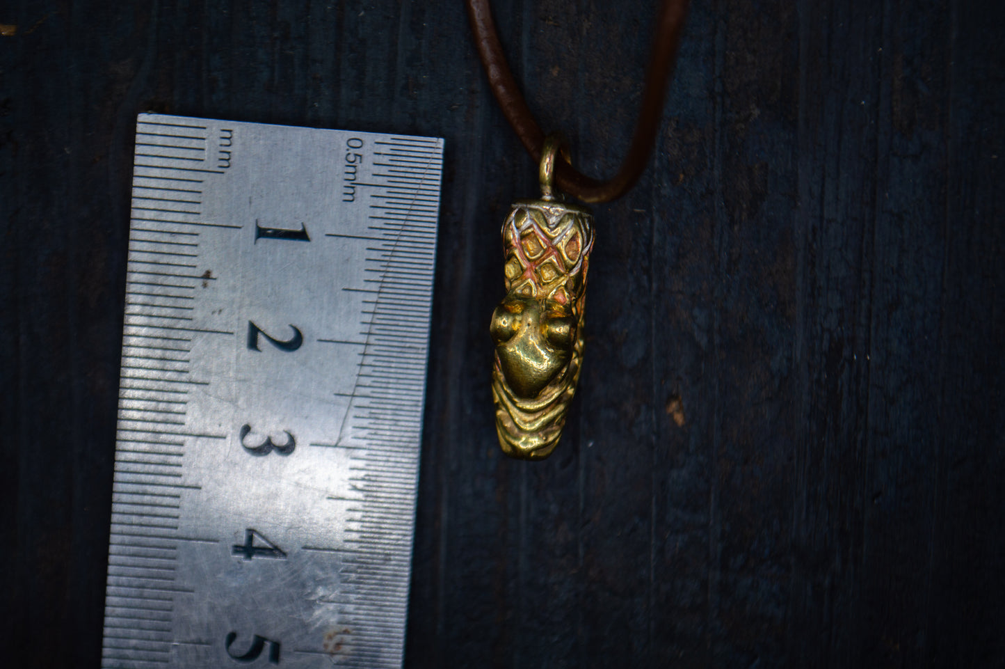 Brass pendant with a bear motif