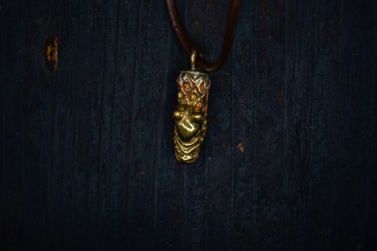 Brass pendant with a bear motif