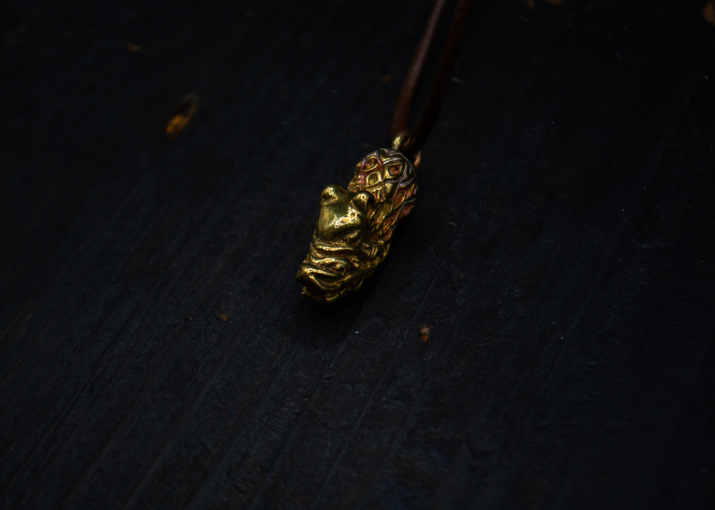 Brass pendant with a bear motif