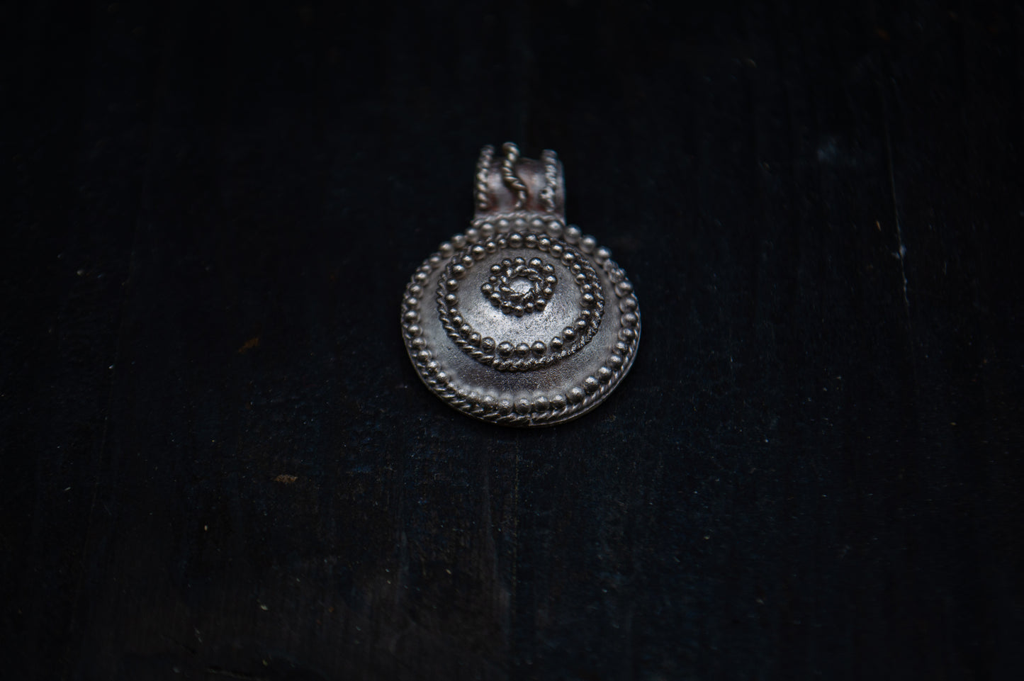 Silver pendant with filigree and granulation