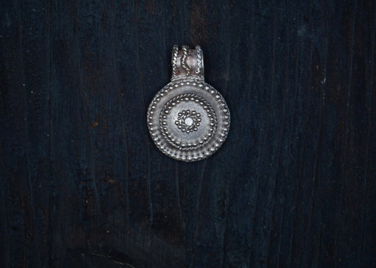 Silver pendant with filigree and granulation