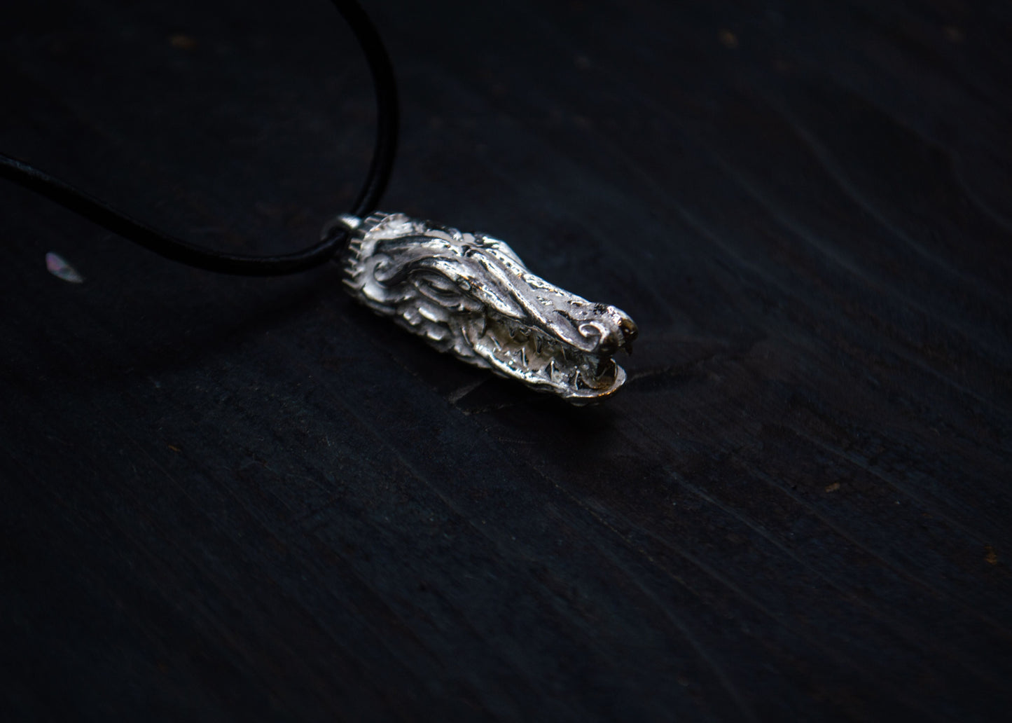 Silver pendant with a sea dragon motif
