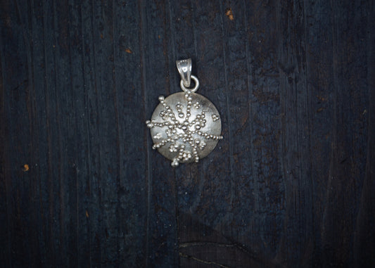 Silver pendant with filigree and granulation