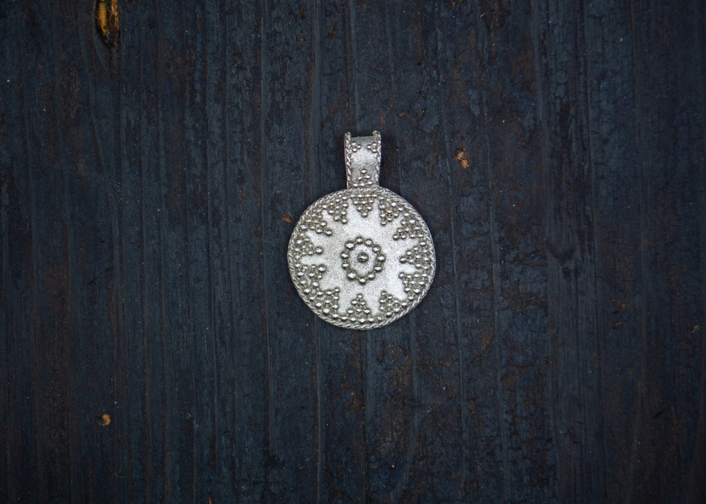 Silver pendant with filigree and granulation