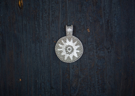 Silver pendant with filigree and granulation