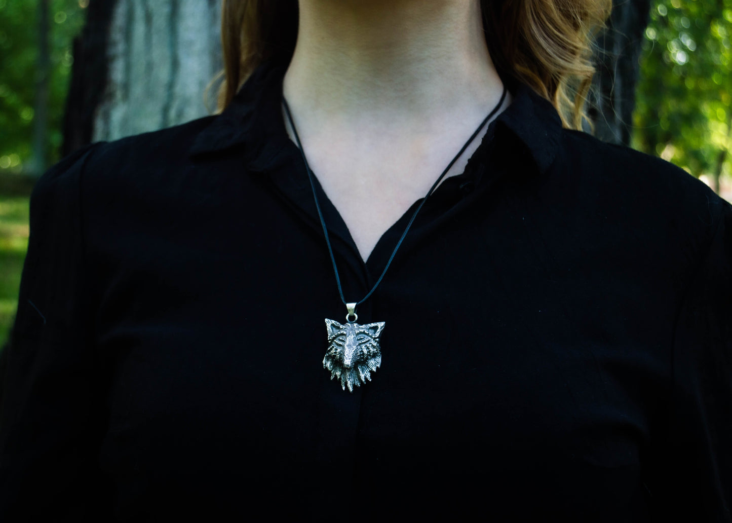 Silver pendant with a wolf motif