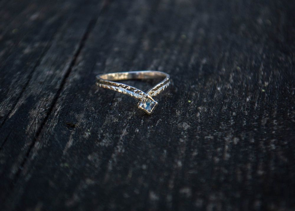 Silver ring with a moonstone and simple engravings