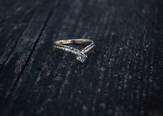 Silver ring with a moonstone and simple engravings